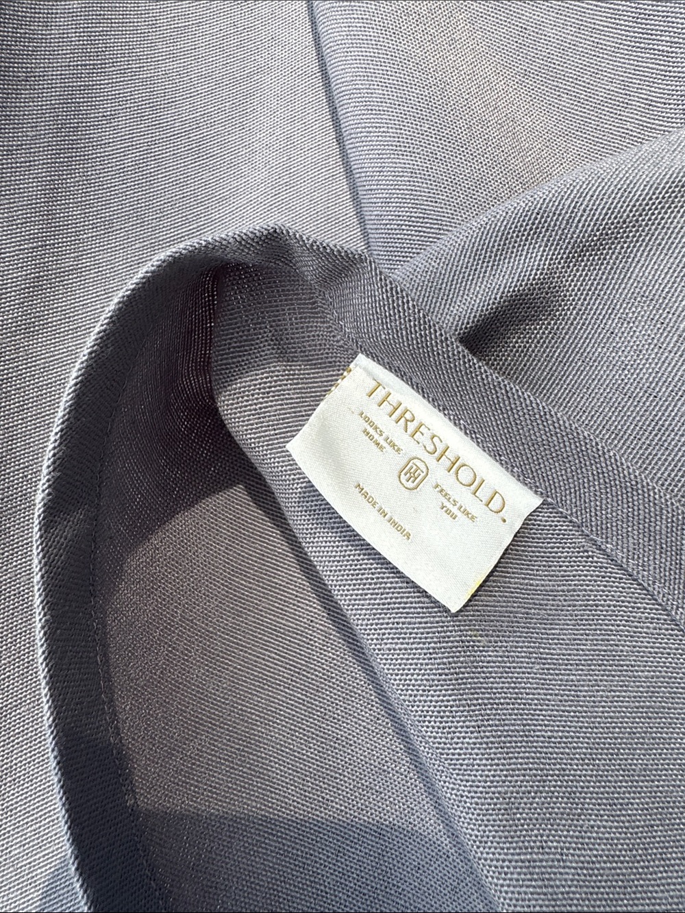 Threshold gray oval table cloth. Seats 4